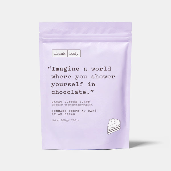 A light lavender stand-up pouch of Frank Body Cacao Coffee Scrub, featuring a quote on the front and a small cake illustration, set against a light gray background.