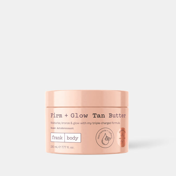 A 230ml tub of frank body Firm + Glow Tan Butter. Text on the tub reads: Moisturise, bronze & glow with my triple-charged formula.