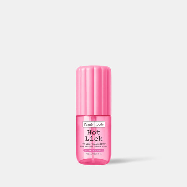 A pink on-the-go bottle of frank body Hot Lick Hair & Body Fragrance Mist, 100ml.